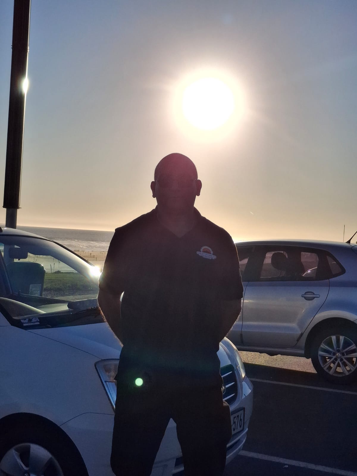 Operator on the beachfront at sunset