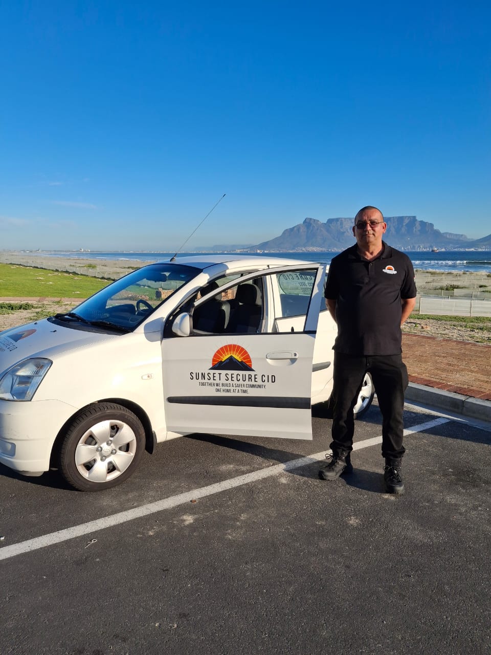 CEO standing beside dedicated patrol vehicle
