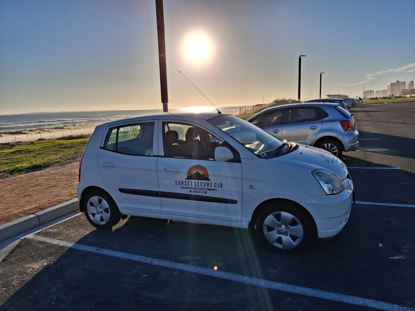 Sunset Secure CID patrol vehicle at the beachfront